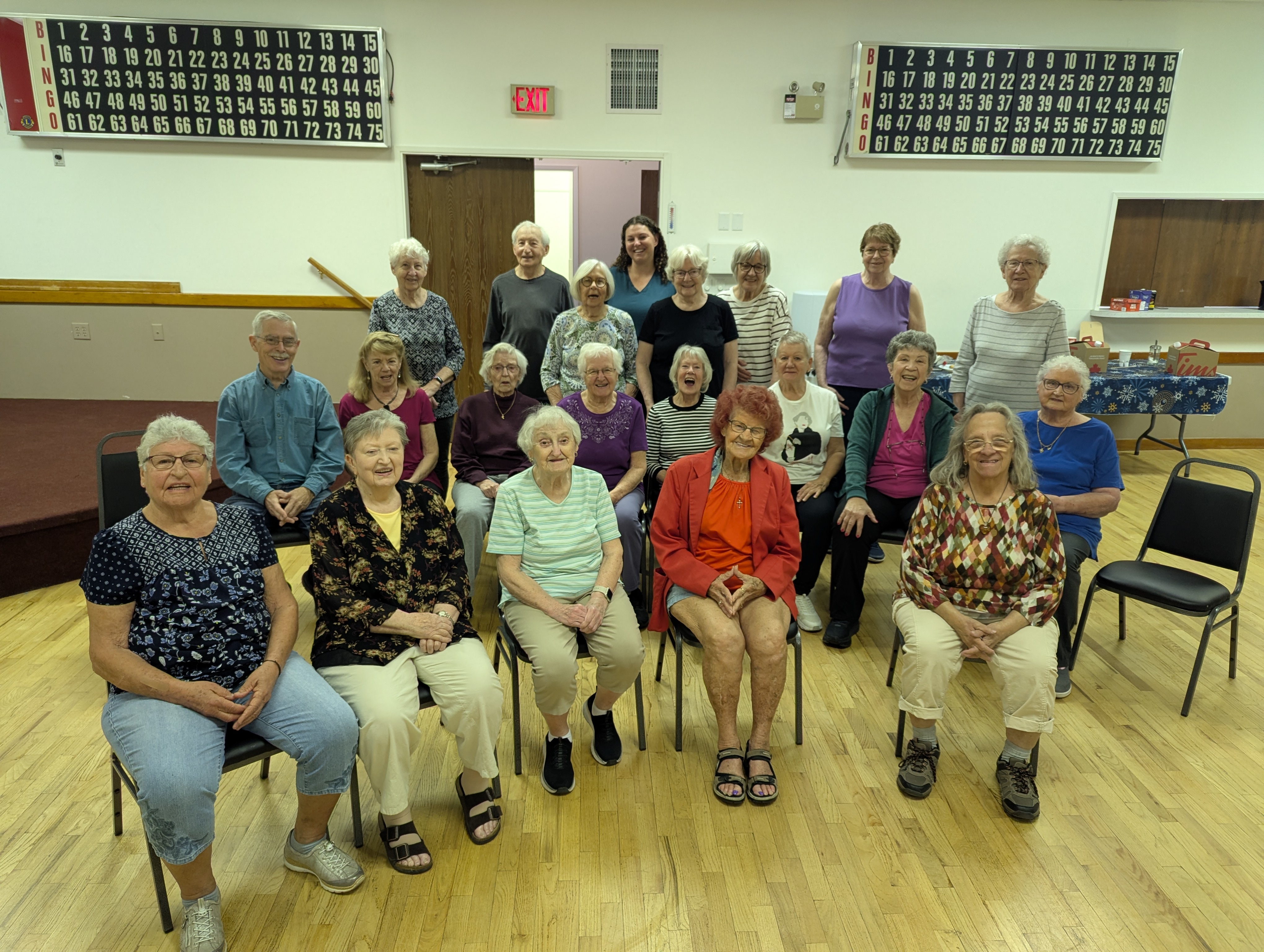 A group of seniors gathered for a TAPS chair yoga class